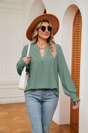 Gum Leaf eyelet detail poet sleeve blouse with V-neck and smocked cuffs.