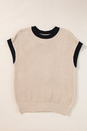 Beige knit cap sleeve top with black trim neckline and armholes.