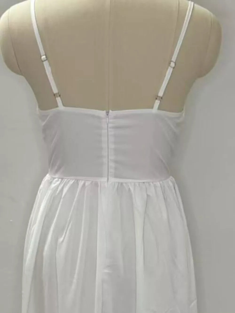 White midi dress with adjustable straps and a-line skirt