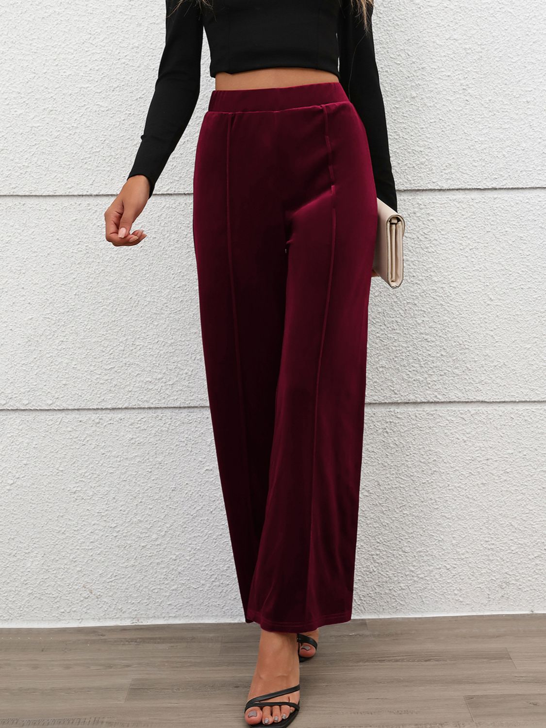 Burgundy velvet palazzo trousers with seam detail and wide leg