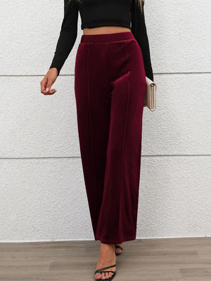 Burgundy velvet palazzo trousers with seam detail and wide leg
