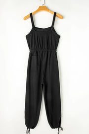 Black waffle knit wide leg jumpsuit with adjustable straps and drawstring waist