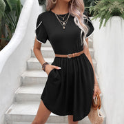 Black casual day dress with scalloped sleeves and a braided belt.