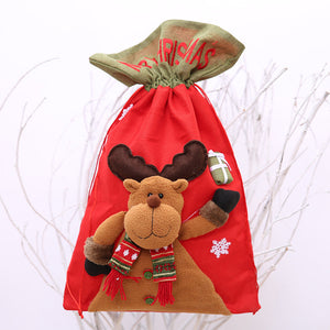 Red drawstring gift sack with plush reindeer, festive scarf, and Christmas text.