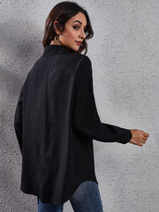 Black polyester button-down blouse with long sleeves and a relaxed fit.