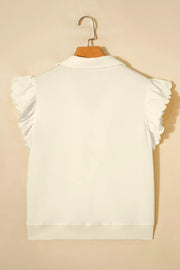 White cotton blouse with ruffled cap sleeves, stand-up collar, and zip detail.