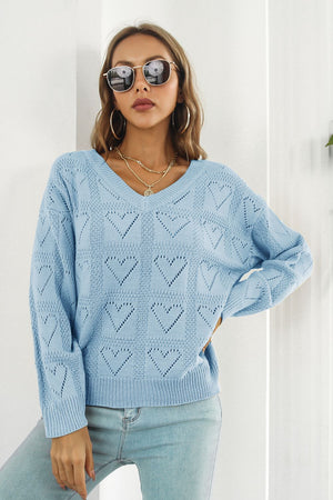 Light blue V-neck knit pullover sweater with allover heart stitch pattern.