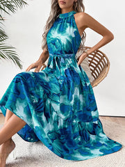 Blue floral halter neck midi dress with tiered skirt and belt