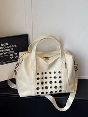 Cream travel organizer bag with eyelet detail and detachable strap