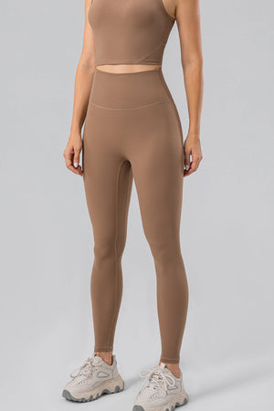 Camel high-waist performance leggings with a sculpted fit and seamless design.