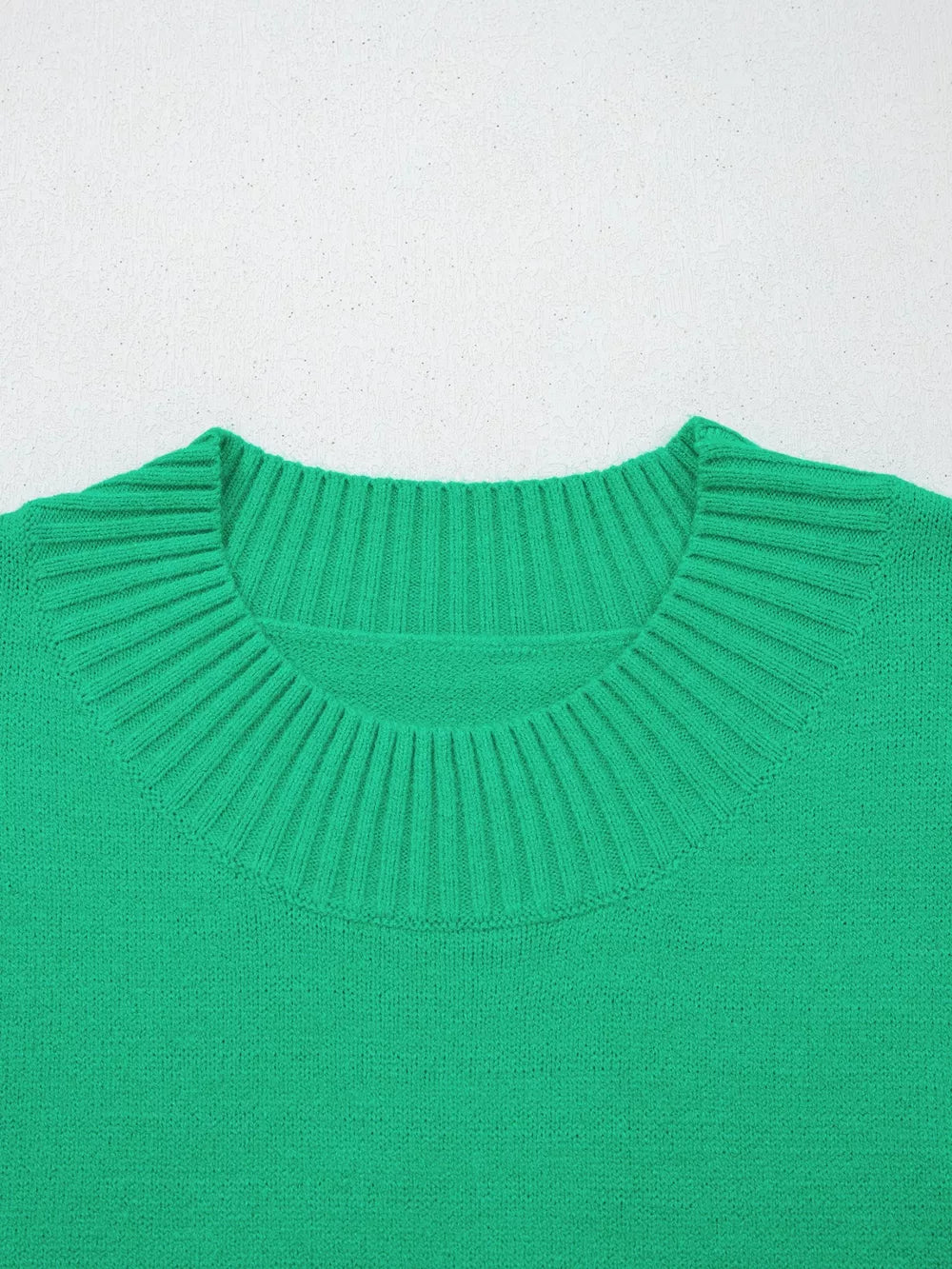 Green ribbed knit top with ruffled round neck