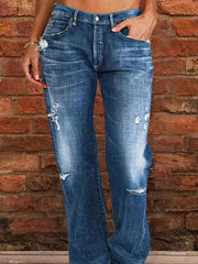 Blue denim maternity jeans with relaxed fit, distressed details, and raw hem.