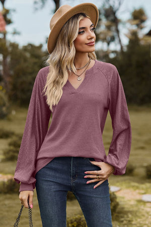 Burgundy waffle knit raglan top with laser cut sleeves and v-neck