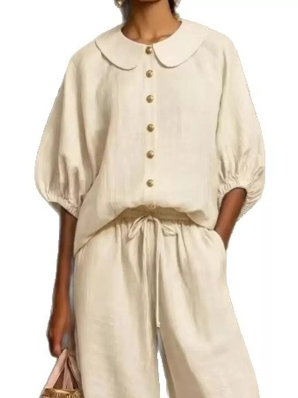 Apricot linen two-piece set with button-down top, Peter Pan collar, puff sleeves, and drawstring pants with pockets.