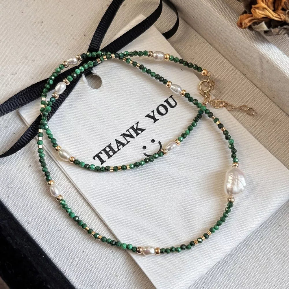 Elegant freshwater pearl and malachite beaded necklace with gold accents