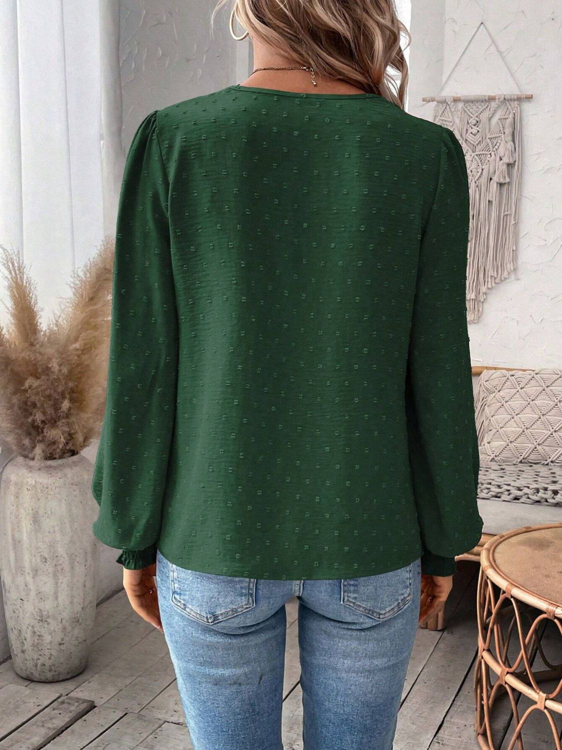 Dark Green textured blouse with puff sleeves and ruffled cuffs.