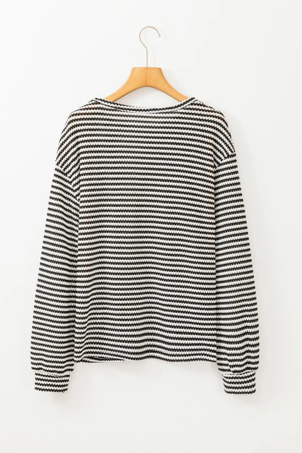 Black and white striped long sleeve tee with a crew neck.