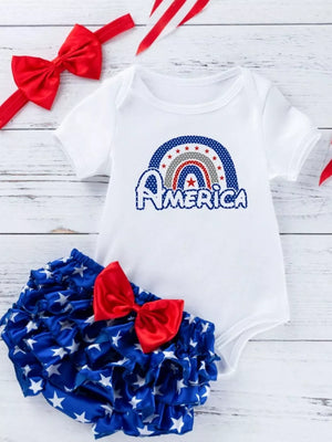 White baby onesie with rainbow America graphic and ruffled star bloomer with red bow