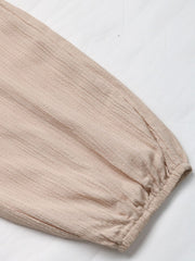 Tan textured cargo trousers with drawstring detail and elasticated cuff.
