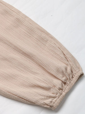Tan textured cargo trousers with drawstring detail and elasticated cuff.