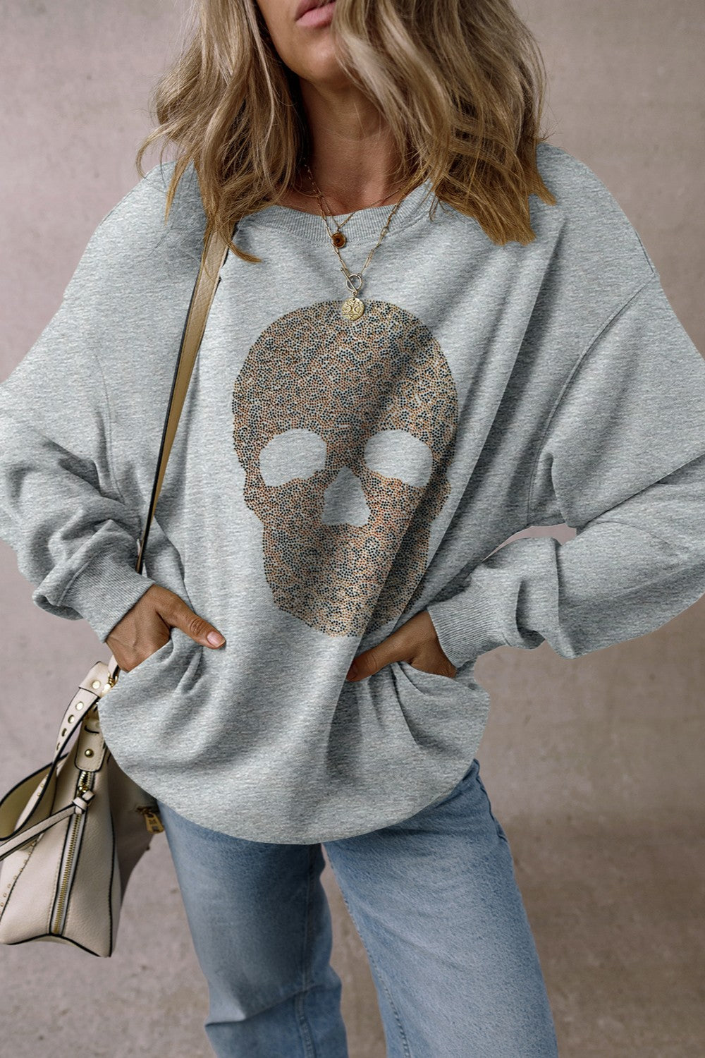 Gray cotton sweatshirt with embellished skull motif and crew neck.
