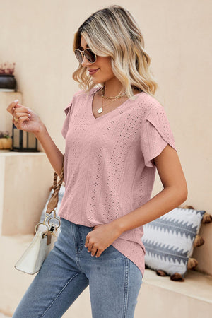 Blush pink knit top with perforated sleeve detail and V-neck.