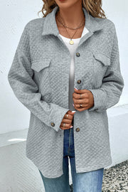 Quilted overshirt in grey with patch pockets and button front.