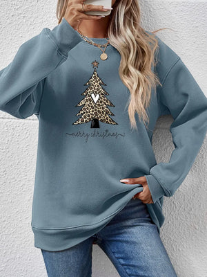 Misty Blue sweatshirt with leopard print Christmas tree graphic and Merry Christmas text.