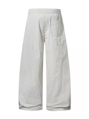 Men's cream white wide-leg cargo pants with elastic waist and back pocket.