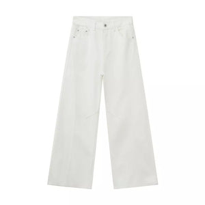 White cotton wide leg jeans with a relaxed fit and visible stitching details.
