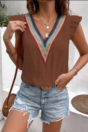 Brown flutter sleeve blouse with embroidered V-neck trim and ruffled sleeves.