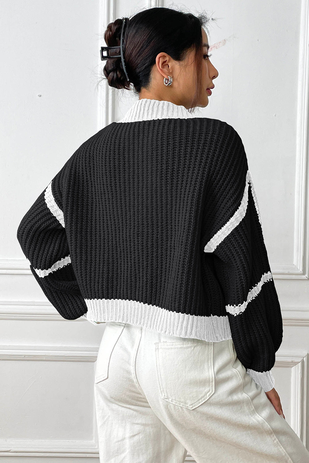 Colorblock ribbed black cardigan with white trim and sleeve details, cropped length