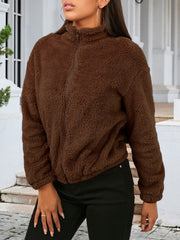 Brown sherpa bomber jacket with zip front and stand-up collar.