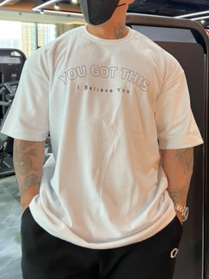 White oversized tee with "You Got This" graphic print and crew neck.