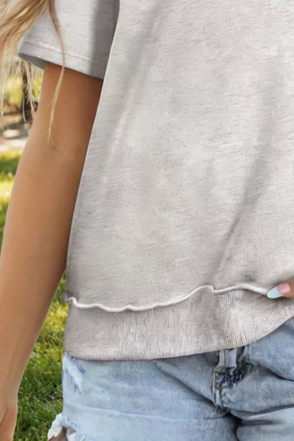 Light grey cotton blend oversized t-shirt with lettuce hem detail.