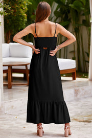 Black smocked bodice maxi dress with spaghetti straps and a cutout detail.