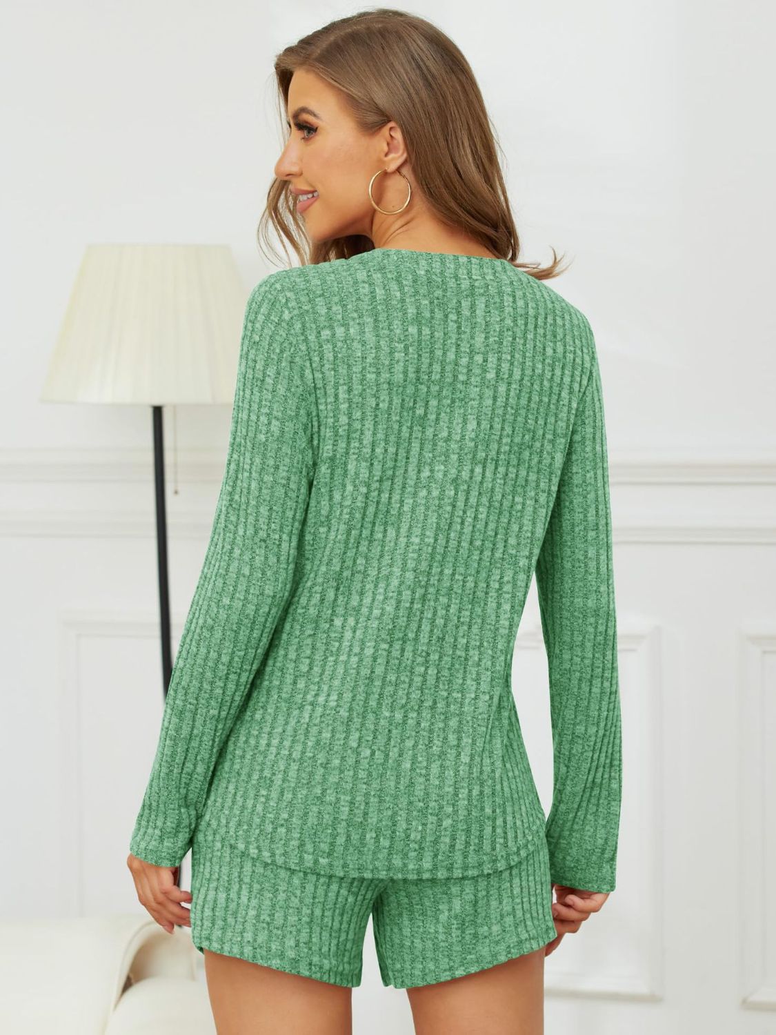 Green ribbed Henley lounge set with long sleeves and shorts.