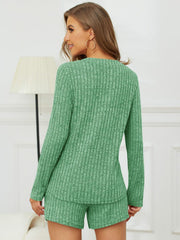 Green ribbed Henley lounge set with long sleeves and shorts.