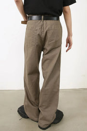 Relaxed carpenter denim trousers in taupe with a wide leg and dual back pockets.