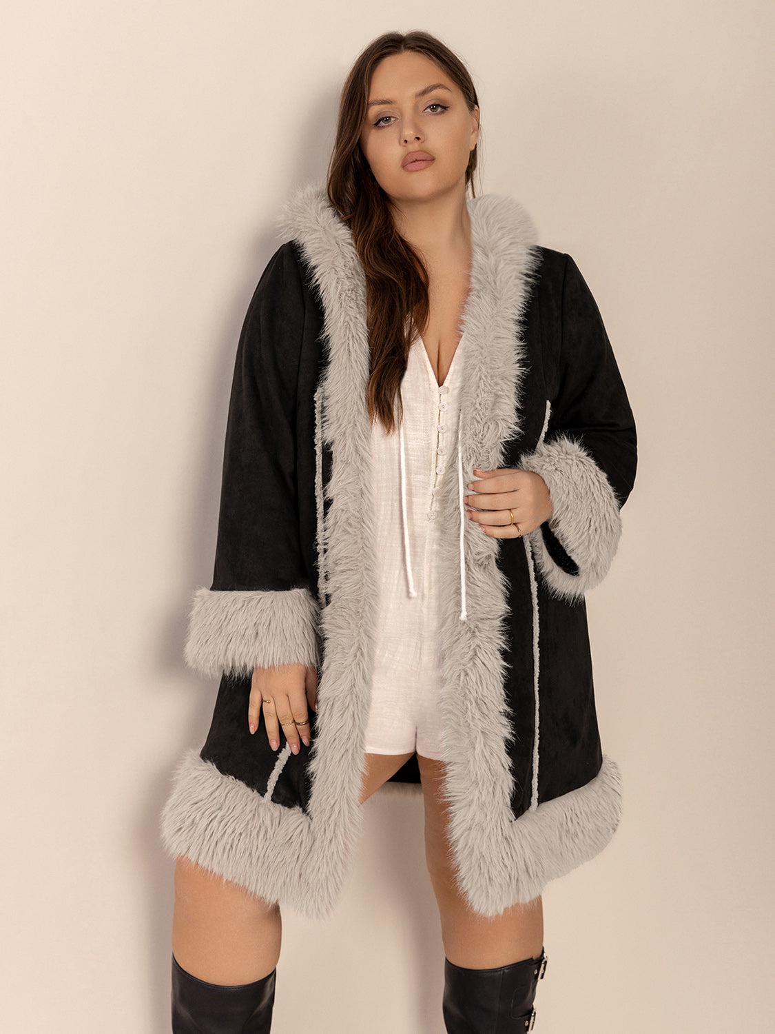 Black hooded duster coat with faux shearling trim and cuffs.
