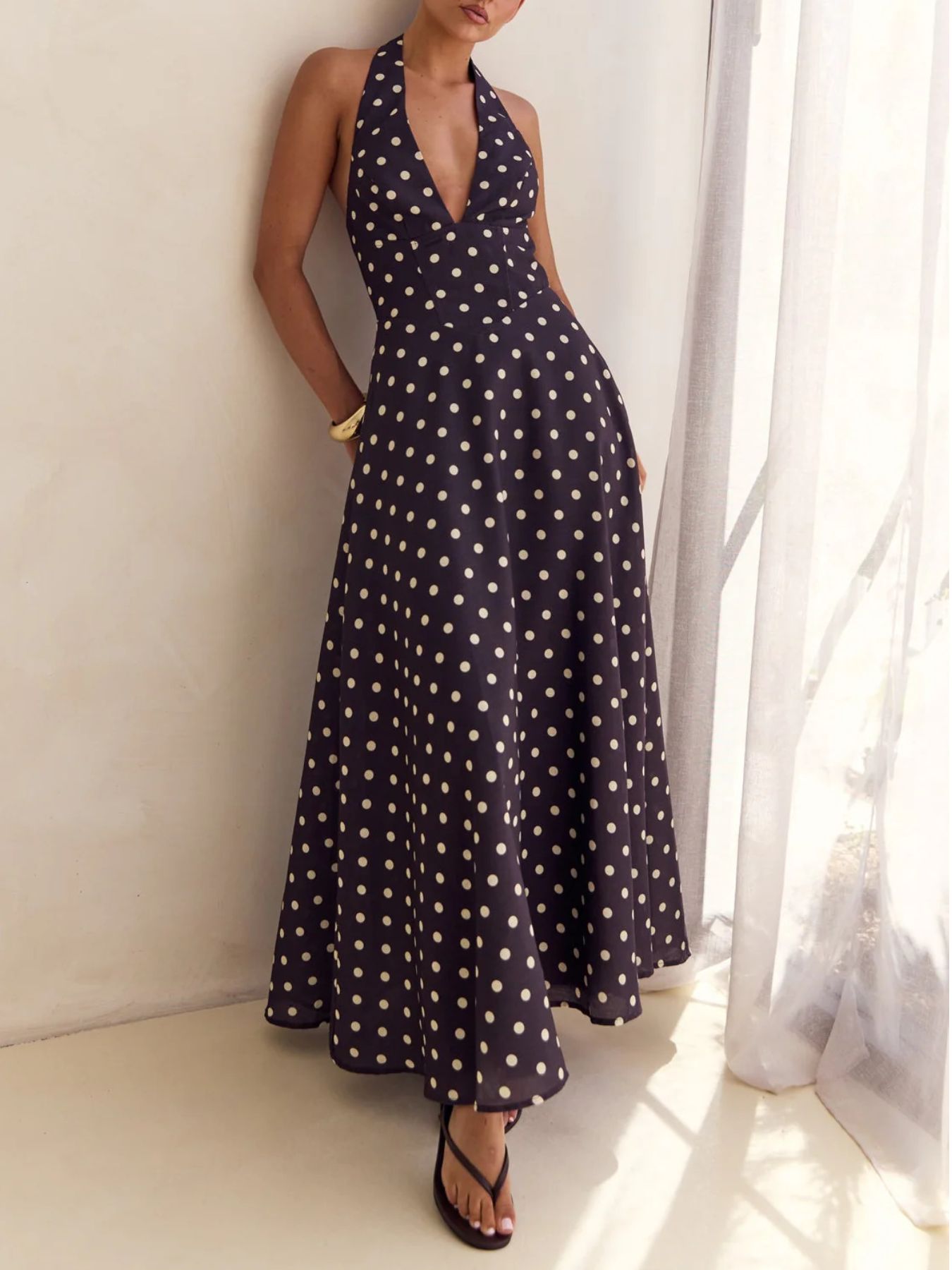 Navy polka dot halter neck maxi dress with a-line skirt