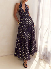 Navy polka dot halter neck maxi dress with a-line skirt