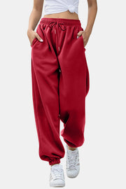Deep Red slouchy sweatpants with gathered cuffs and drawstring waist.