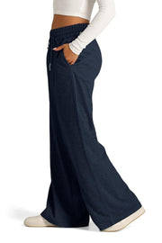 Navy seamed palazzo lounge trousers with drawstring waist and pockets.