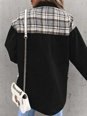 Black denim jacket with plaid paneling on shoulders and upper back.