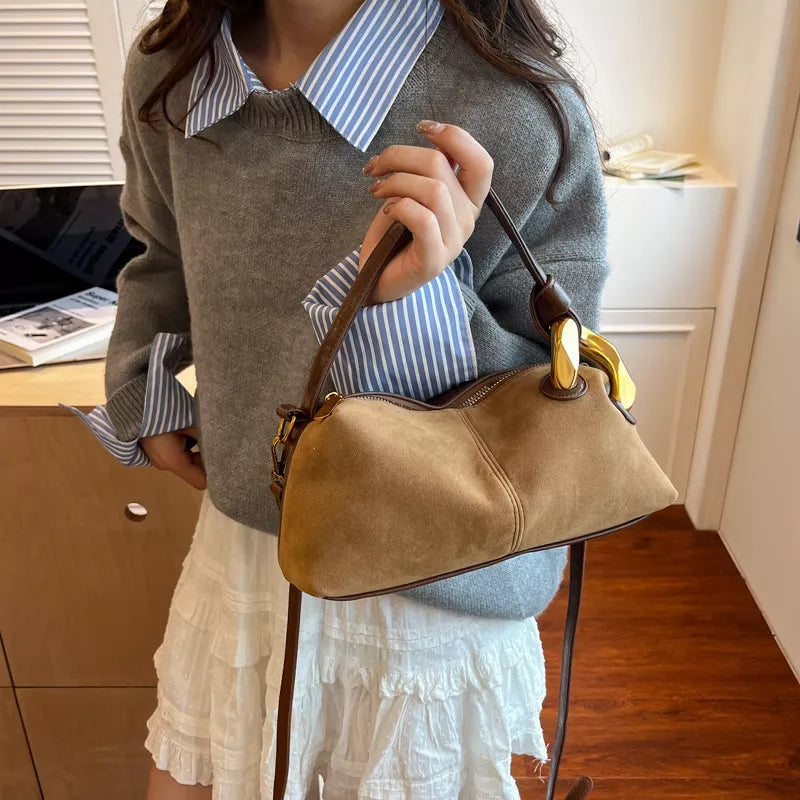Taupe suede crossbody bag with gold hardware detail