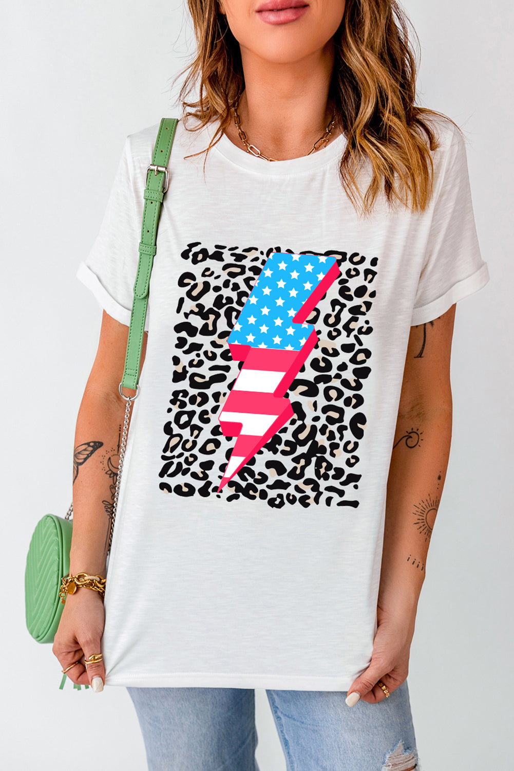White t-shirt with leopard print and American flag lightning bolt graphic.