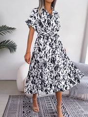 Dalmatian print midi shirt dress in white with short sleeves and a tie waist.