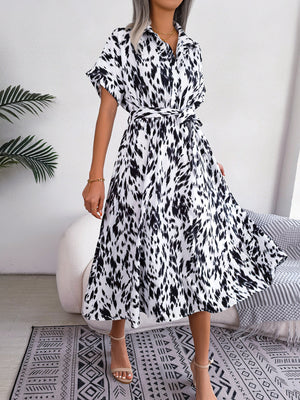 Dalmatian print midi shirt dress in white with short sleeves and a tie waist.