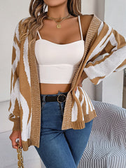 Tan and white zebra stripe open-front knit cardigan with a relaxed fit.